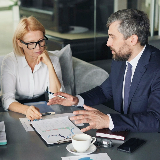 Two people talking about report